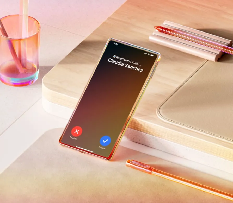 A smartphone displaying an incoming call with options to decline or accept rests on a beige table.