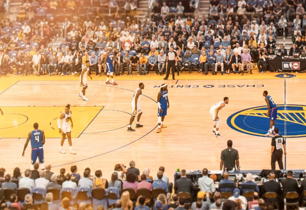 Golden State Warriors team are on the court for a basketball game