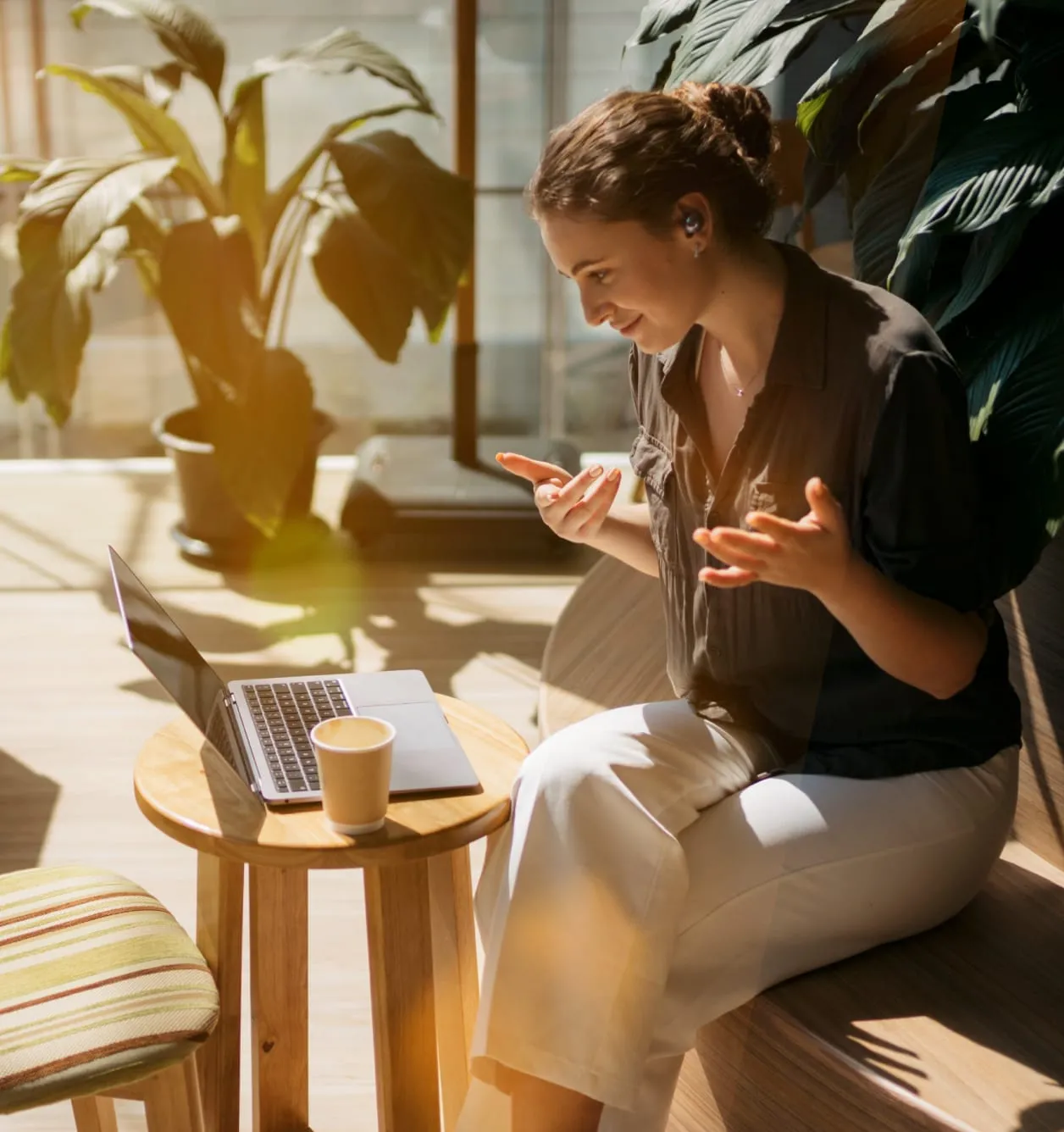 A woman is speaking animatedly on a video call
