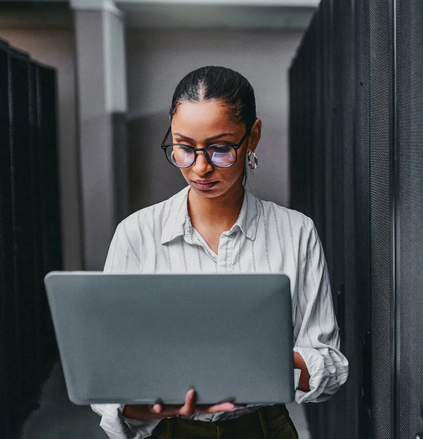 A female security researcher looks for vulnerabilities in a website using her laptop